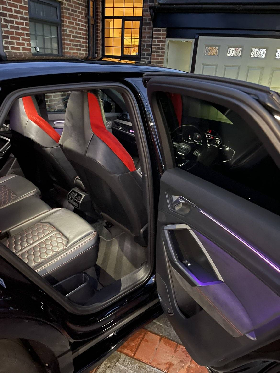 Professionally detailed vehicle interior with red seats